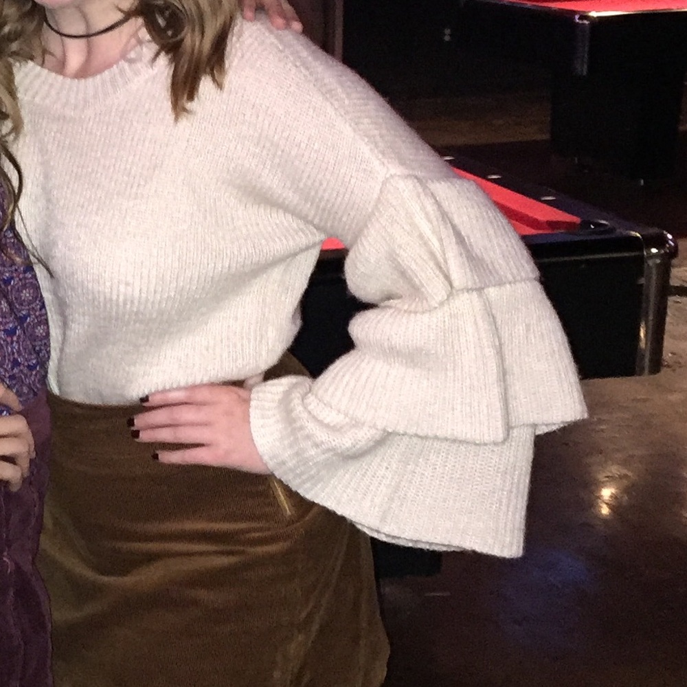 Francesca’s tiered bell sleeve sweater.